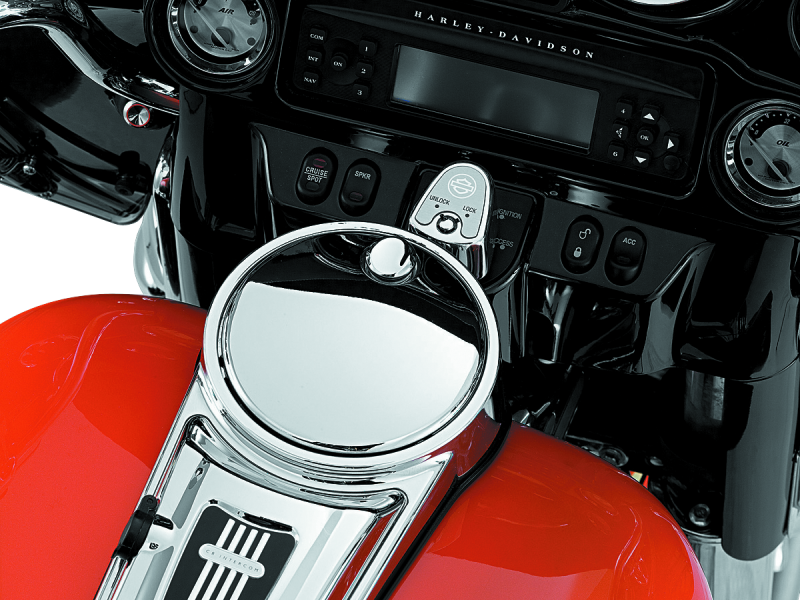 Kuryakyn chrome push-button fuel door latch for Harley-Davidson touring bikes, showing the latch and surrounding chrome detail.