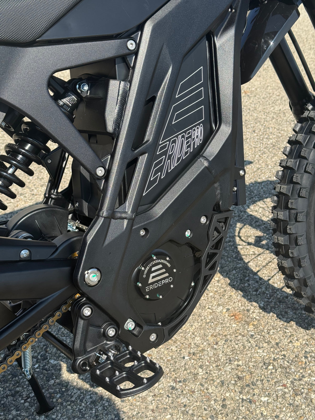 E Ride Pro SR electric dirt bike with 25KW motor, black frame, knobby tires, and sleek design for off-road riding.