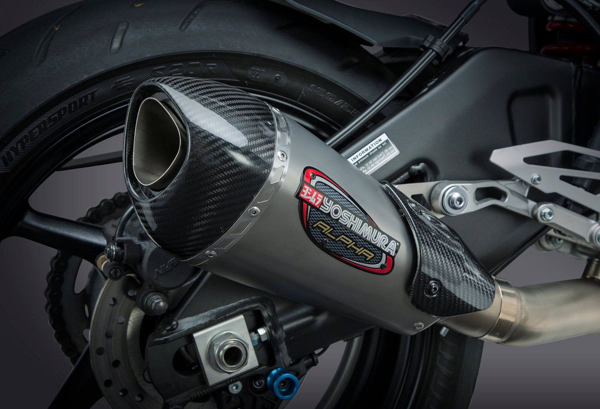 YOSHIMURA Yoshimura Exhaust Race Alpha T 3/4 Slip-On with carbon fiber end cap mounted on motorcycle side view