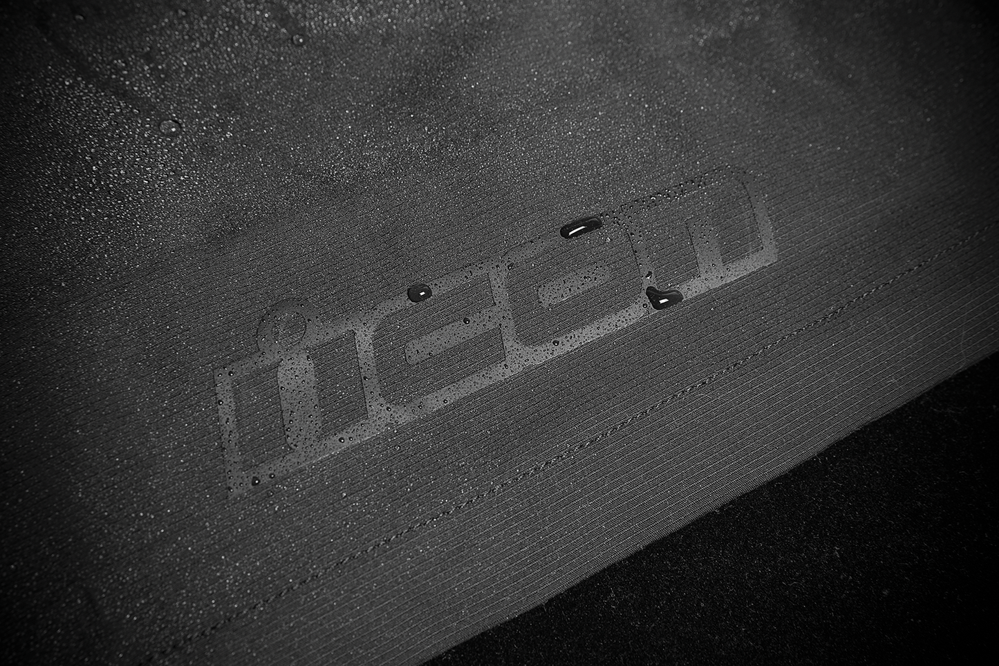 Black ICON Stormhawk Jacket CE in XL size, shown with detailed front view, featuring protective padding and sleek design.
