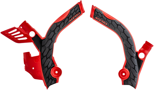 A set of ACERBIS X-Grip motorcycle frame guards in red and black, designed to protect the bike's body and frame.