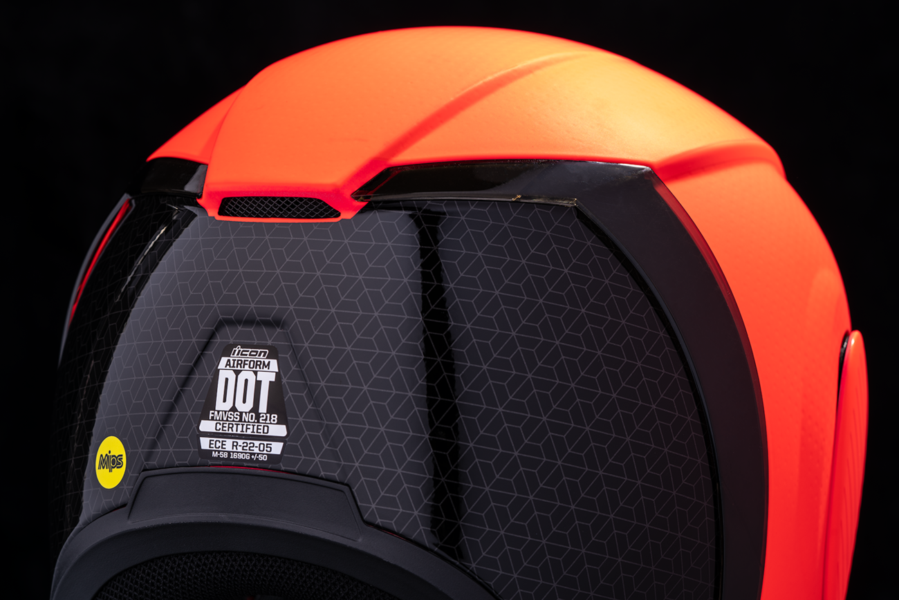 Red ICON Airform MIPS helmet in small size with Counterstrike design, featuring a sleek aerodynamic shape and adjustable straps.