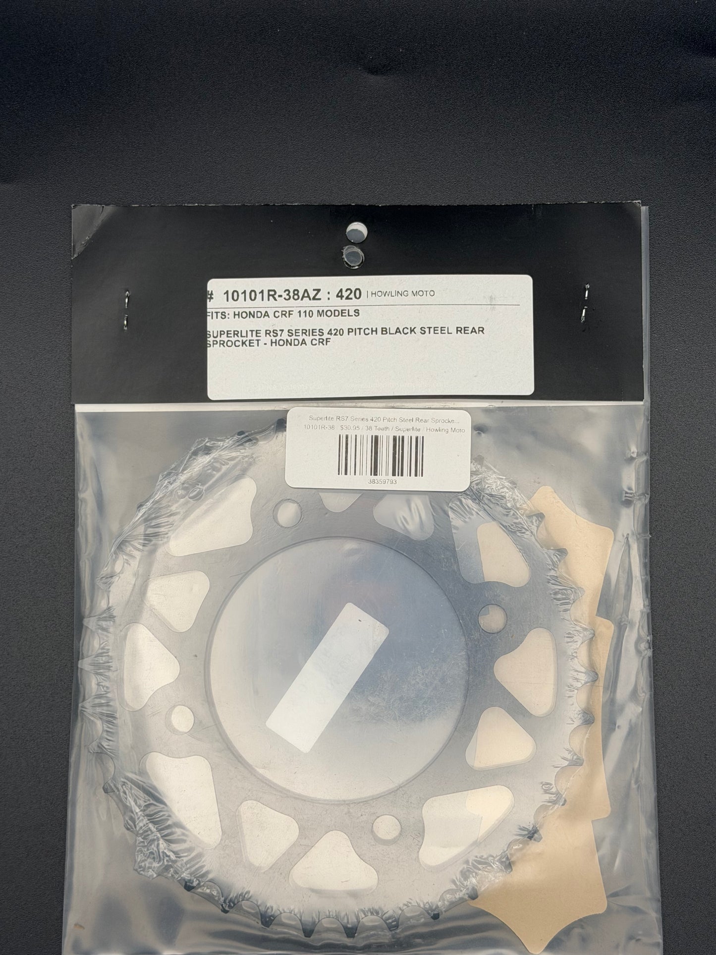 Superlite RS7 Series 420 pitch steel rear sprocket for Honda CRF110 motorcycle, with gear teeth and metallic finish.