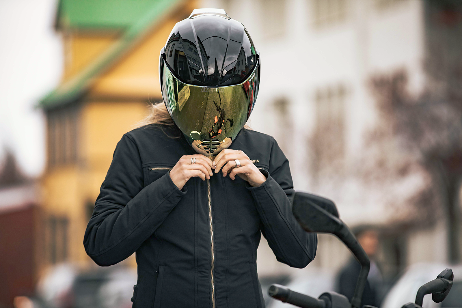 Black ICON Airflite™ helmet in gloss finish, medium size, featuring aerodynamic design and clear visor, branded by Bill's Exhausts.