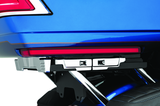 Kuryakyn Tracer Tour Pak side lights with red lens installed on Harley Davidson touring motorcycle for enhanced visibility.