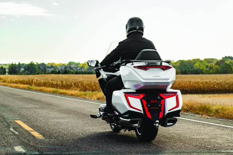 Kuryakyn Omni LED rear bag accents on Honda GL1800 Gold Wing motorcycle, highlighting sleek LED light details on the luggage.