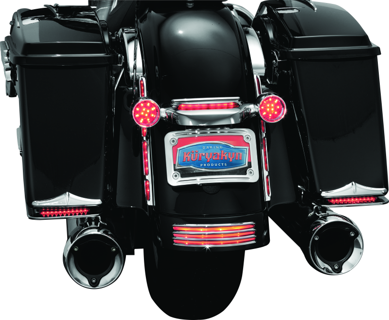 Chrome Kuryakyn curved license plate mount for Harley-Davidson Street Glide and Road Glide motorcycles.