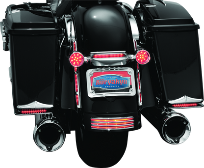 Chrome Kuryakyn curved license plate mount for Harley-Davidson Street Glide and Road Glide motorcycles.