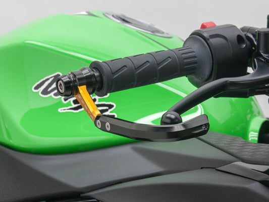 ZETA ZETA lever guard in gold for motorcycle, part ZS72-1004, showing protective lever cover with gold finish and mounting hardware.