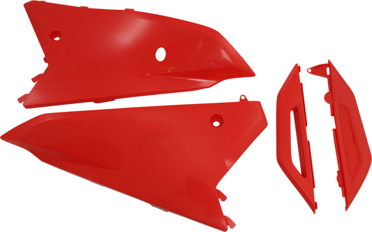 A close-up of red Acerbis side panels for a motorcycle, showcasing the body panels with the Acerbis branding.