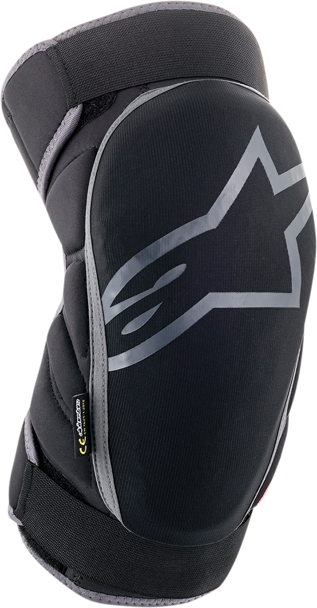 Alpinestars Vector knee guards in black, anthracite, and red, showing protective padding and adjustable straps for knee support.