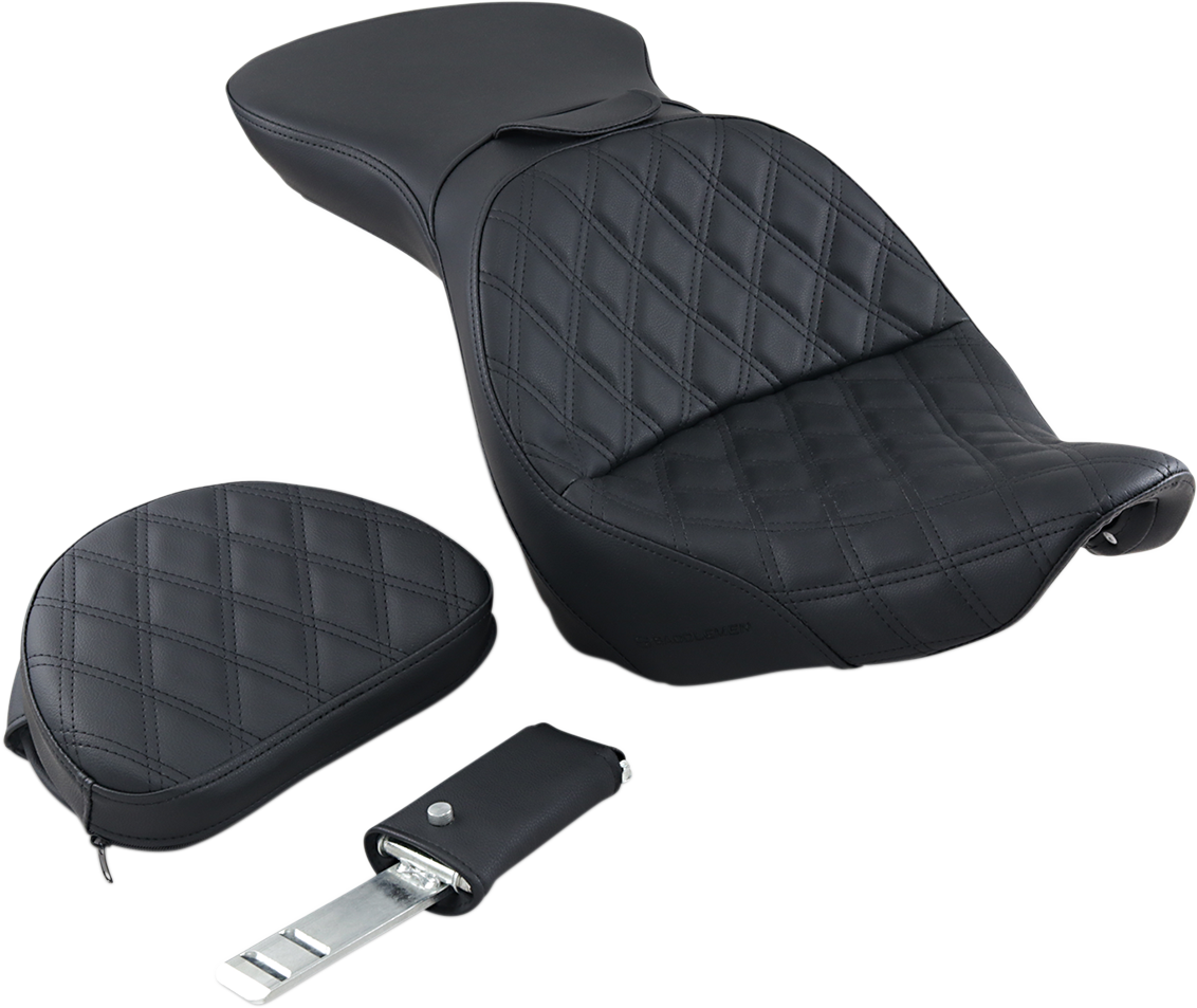 Black Saddlemens Explorer motorcycle seat with backrest and lattice stitching for FXST bikes, featuring a sleek, padded design.