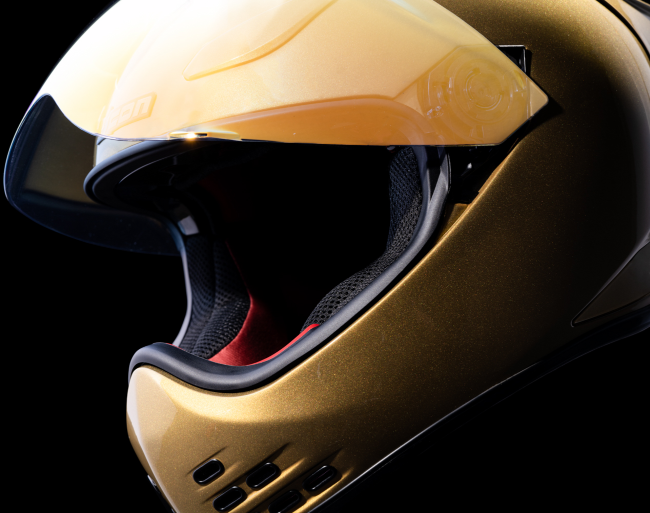 Gold ICON Domain™ Cornelius helmet in small size with sleek design, featuring a smooth finish and modern helmet style.