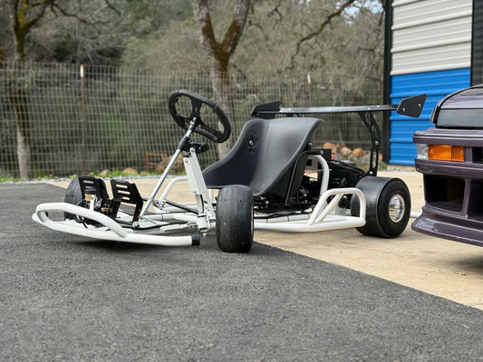 Electro & Co E-Drift Kart electric drift kart with sleek black design and large wheels, ready for indoor or outdoor racing fun.