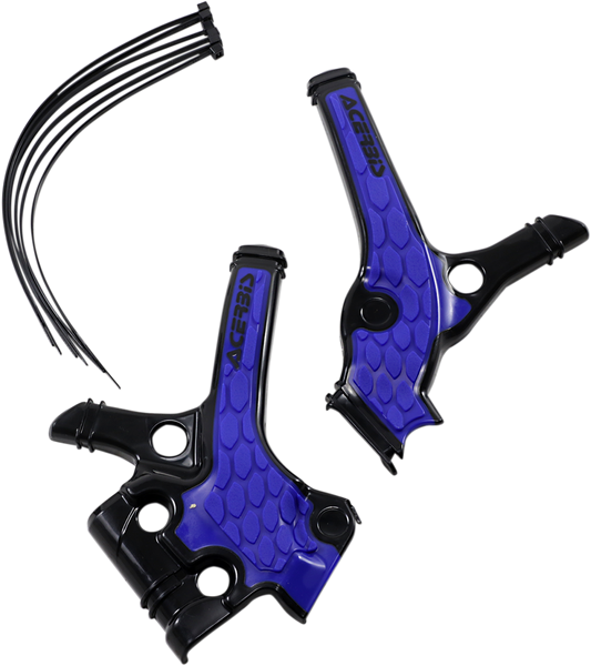 A close-up of ACERBIS X-Grip black and blue motorcycle frame guards showing textured body protection on a bike.