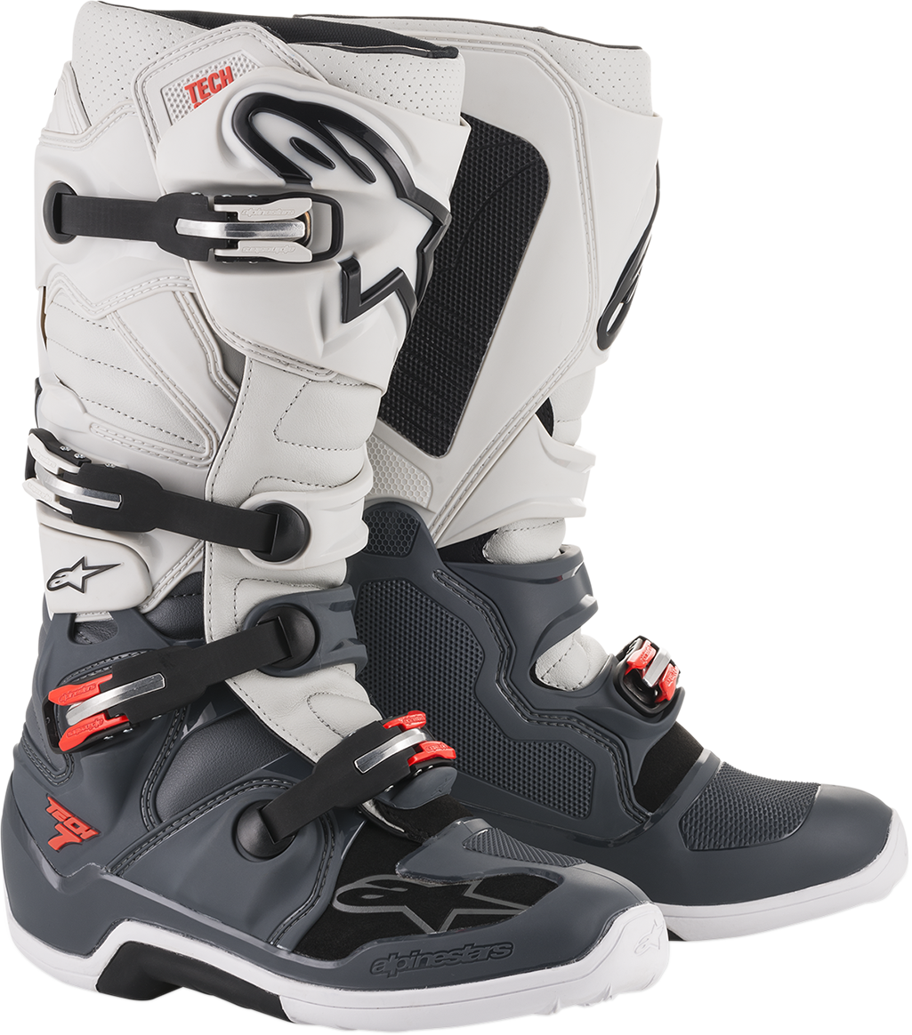 Alpinestars Tech 7 off-road motorcycle boots in gray and white, US size 12, featuring protective design and sturdy construction.