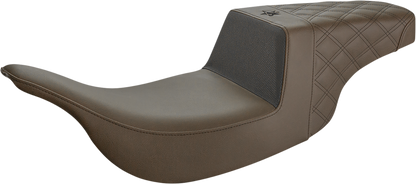 Front carbon fiber and black gripper lumbar seat by Saddlemens Unknown Industries with lattice stitch pattern for motorcycle or bike.