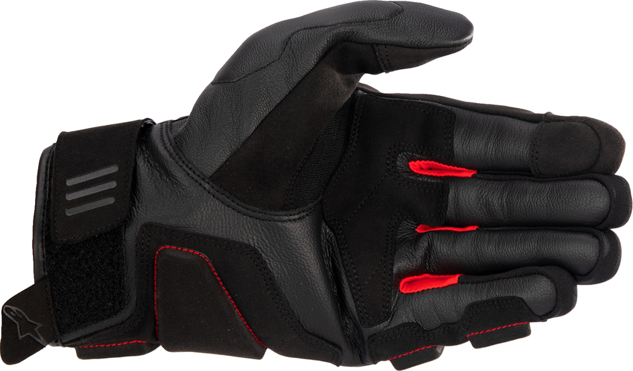 Black and bright red Alpinestars Phenom motorcycle gloves in medium size, featuring protective knuckles and padded palm.