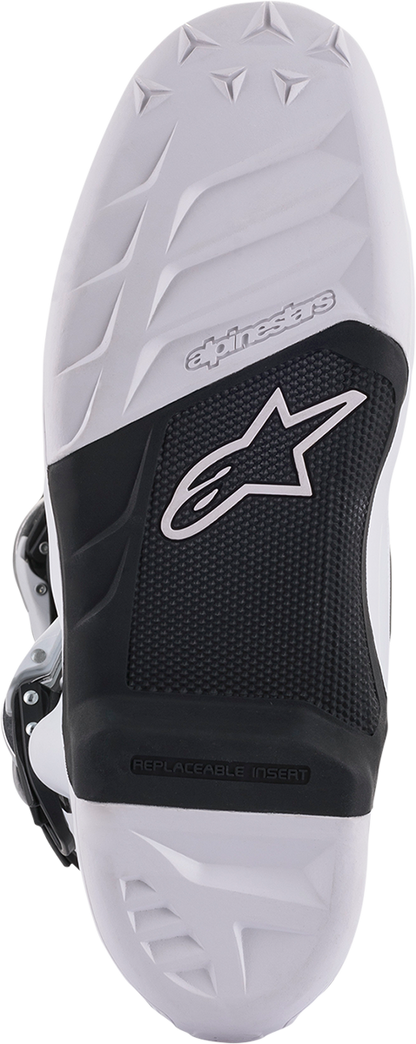 Alpinestars Tech 7 motocross boots in white and black with US size 10, featuring durable construction and adjustable straps.