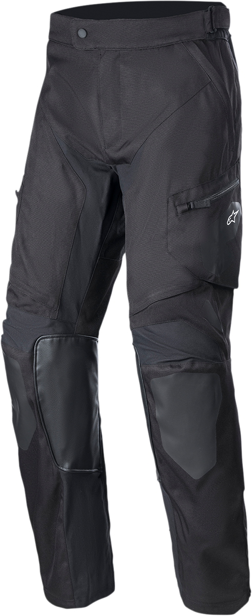Alpinestars Venture XT over-the-boot motorcycle pants in black, medium size, with reinforced knee areas and adjustable waist.