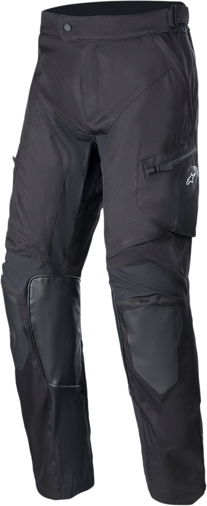 Alpinestars Venture XT over-the-boot motorcycle pants in black, medium size, with reinforced knee areas and adjustable waist.