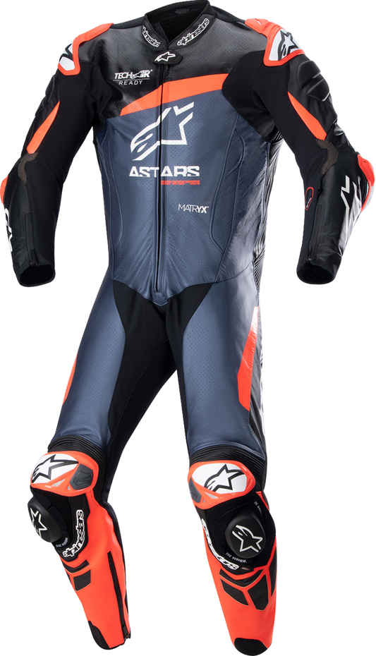 Alpinestars GP Plus v4 leather suit in black, red fluo, and blue, US 44 / EU 54, featuring sleek racing design.