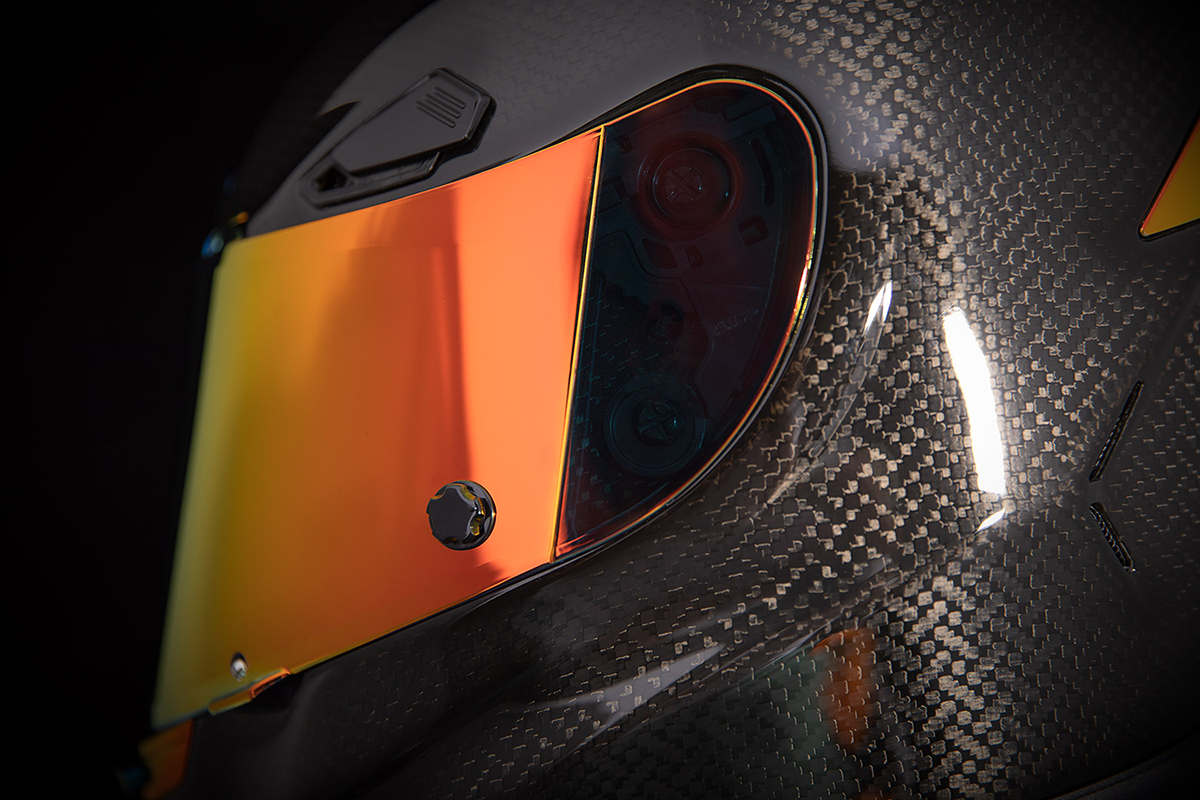 Red ICON Airframe Pro™ helmet in carbon fiber with small size, featuring aerodynamic design and ventilation.