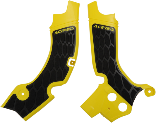 Acerbis X-Grip yellow and black motorcycle frame guards on a bike body, offering protection with a bold design.