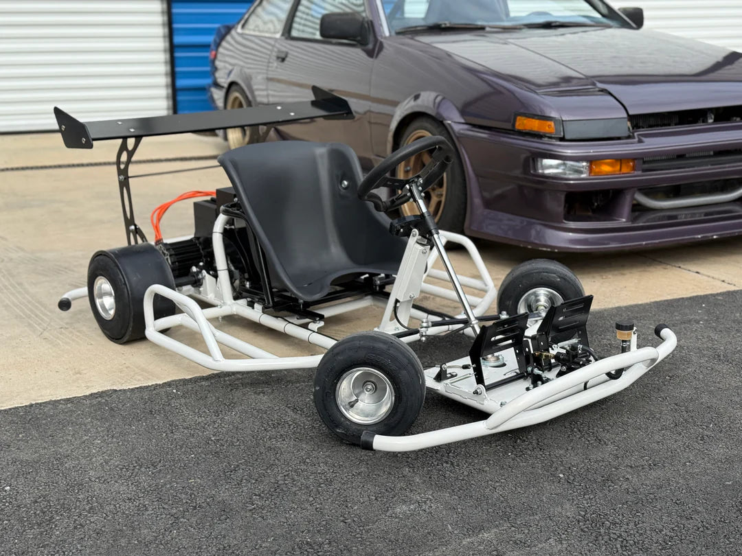 Electro & Co E-Drift Kart electric drift kart with racing seat and steering wheel, ready for outdoor racing fun.