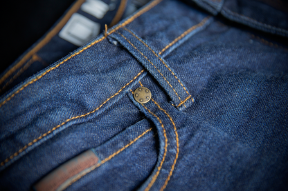 ICON Women's MH1000™ Blue Jeans by Bill's Exhausts, showing the classic fit and denim fabric in a natural pose.
