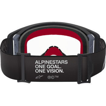 Alpinestars Supertech goggles in black and gray with clear lenses, designed for motocross or racing use.