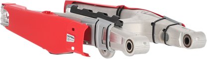 Red Acerbis Swing Arm Guard for motorcycle body protection, designed to fit various models for durable off-road riding.