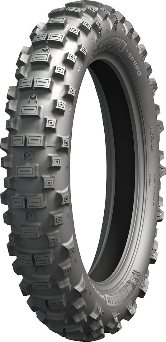 Rear MICHELIN Enduro Xtrem tire 140/80-18 mounted on motorcycle wheel, showing tread pattern and sidewall details.