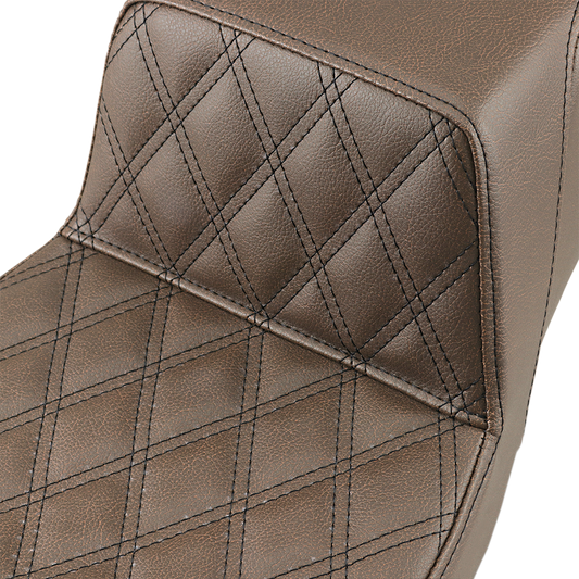 Brown SADDLEMEN Step-Up Seat with front lattice stitch for motorcycles, featuring durable design and detailed stitching.