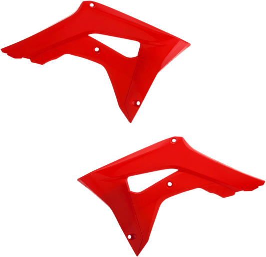 Red ACERBIS radiator shrouds for CRF motorcycle, mounted on the body, with detailed fins and branding visible.