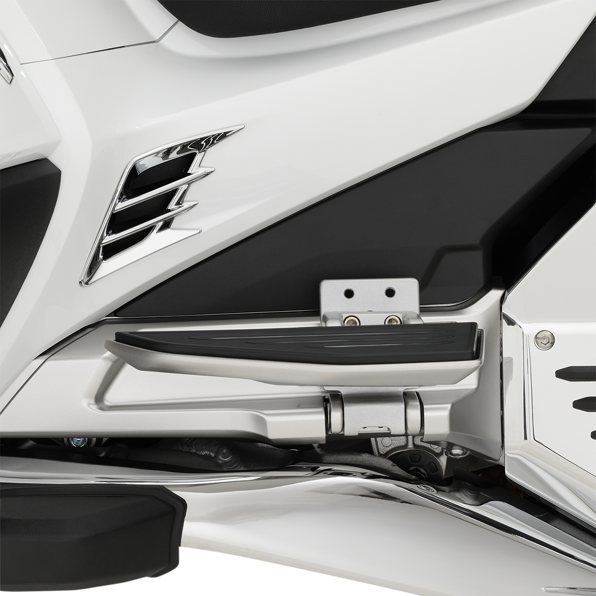Bill's Exhausts Show Chrome Passenger Floorboard Risers for Honda GL1800 motorcycle, engine-mounted with chrome finish.