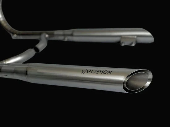BMW R18 titanium exhaust system by Bill's Exhausts, shows sleek, polished exhaust pipes and mounting hardware for the BMW R18 motorcycle.
