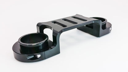 Black Suzuki DR650 fork brace by Warp9Racing, designed for enhanced stability and protection on the motorcycle.