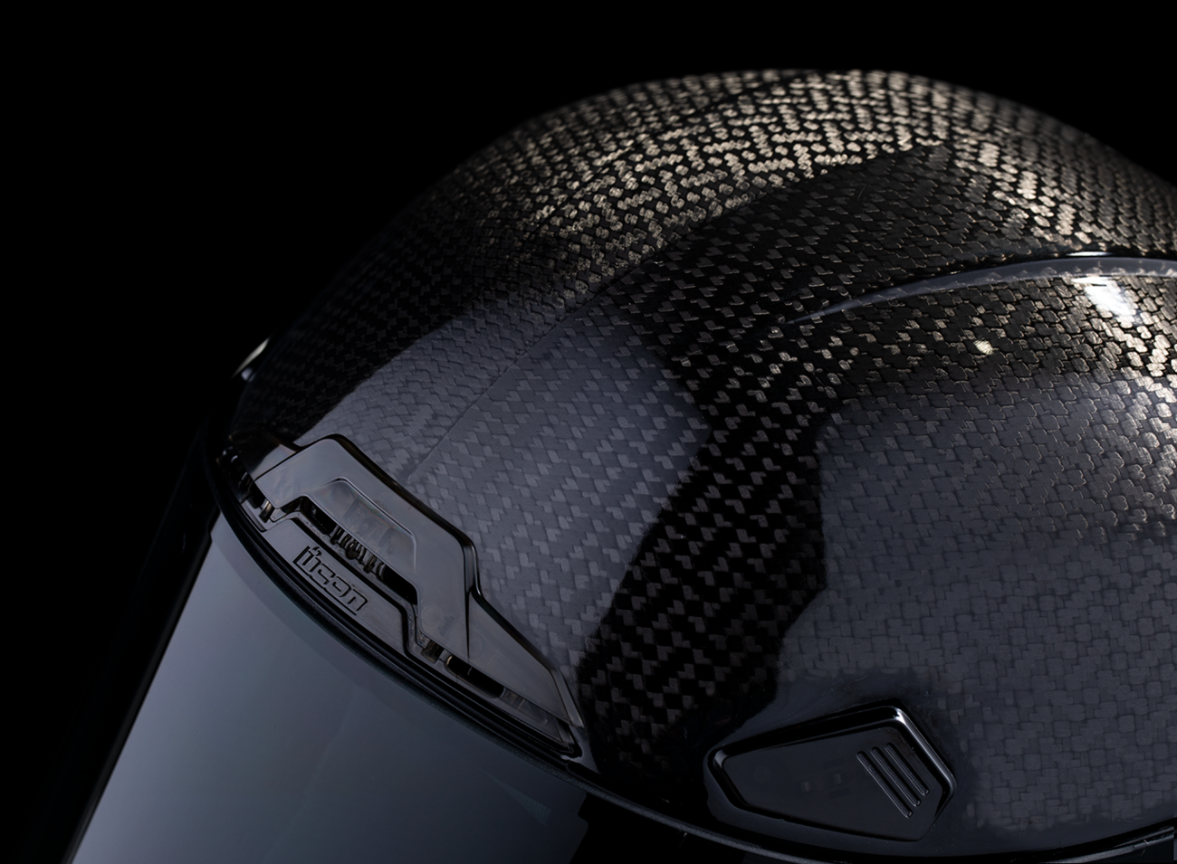 Black ICON Airframe Pro™ helmet in 2XL size with carbon shell, featuring aerodynamic design and matte finish.