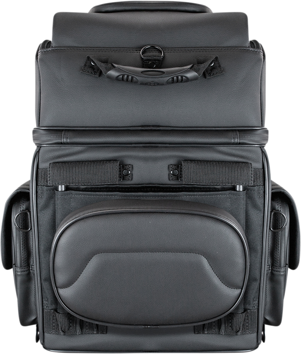 Black Saddlemens BR3400D Sissy Bar Bag mounted on a motorcycle seat, showcasing durable outdoor storage solution.