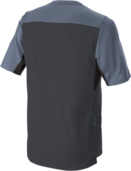 Alpinestars Drop 6.0 V2 short-sleeve black jersey worn by a person, featuring logo and athletic fit, size medium.