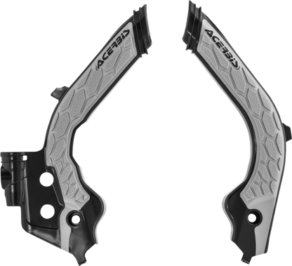 A set of ACERBIS X-Grip black and gray frame guards for motorcycle body protection, shown in a close-up view.