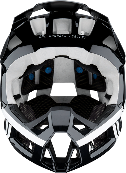 Black and white 100% Trajecta bicycle helmet with Fidlock buckle in XL size, featuring a sleek design and adjustable straps.