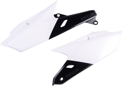 Acerbis white and black side panels for motorcycle body, featuring sleek design and brand logo, on a plain background.