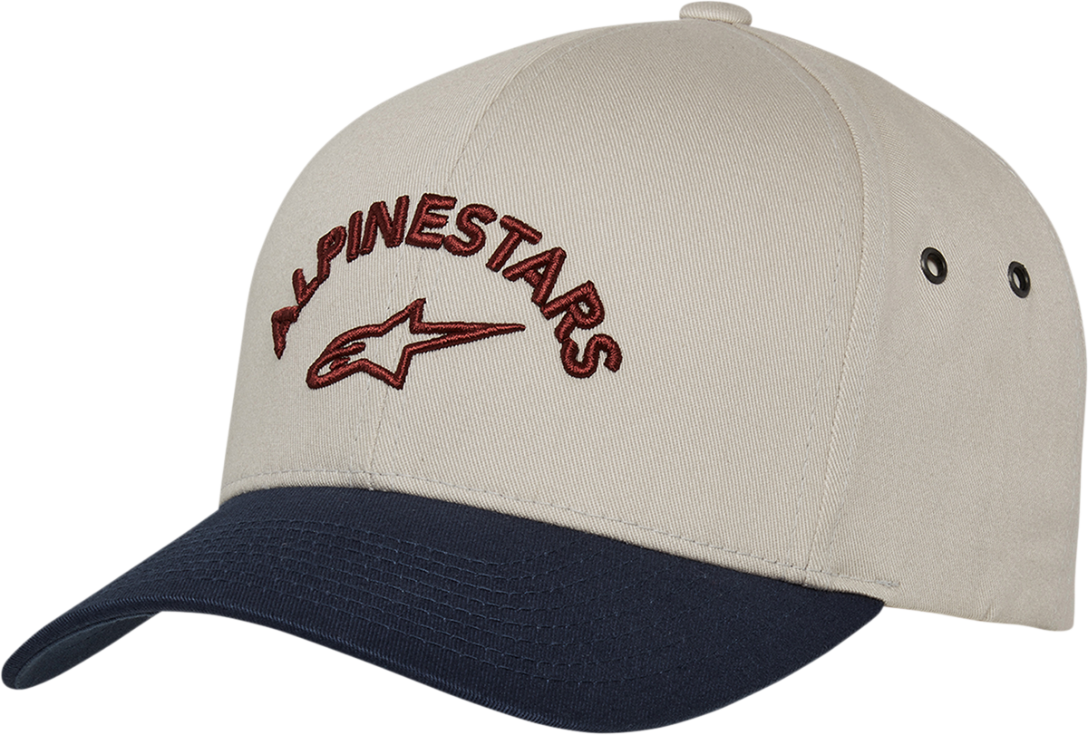 Alpinestars Arced Hat in natural and navy, adjustable one size, featuring protective gear design with branding details.