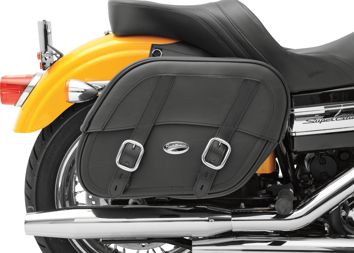Black SADDLEMEN Drifter Saddlebags with Shock Cutaway installed on a motorcycle seat, showcasing their sleek design and saddlebag features.