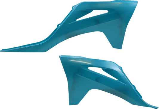 Acerbis radiator shrouds in teal and metallic finish, designed for motorcycle body protection and styling.