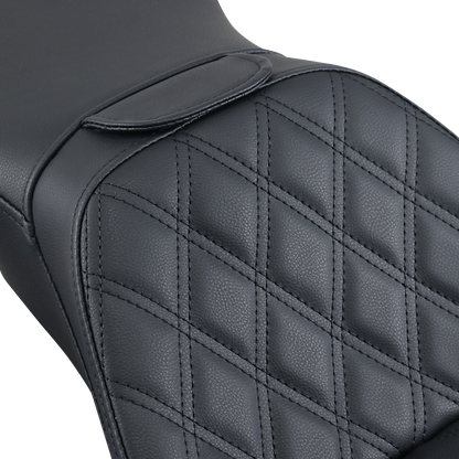 Black SADDLEMEN Explorer motorcycle seat with backrest and lattice stitching, designed for FLSTN models.