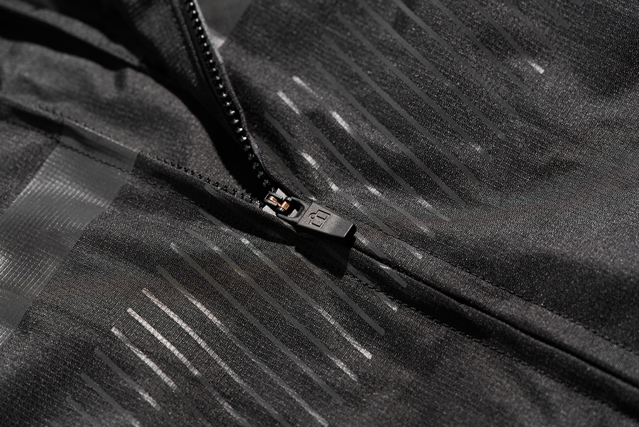 Black ICON Women’s PDX3™ jacket in XS, shown on a hanger, featuring a sleek design with a front zipper and collar.