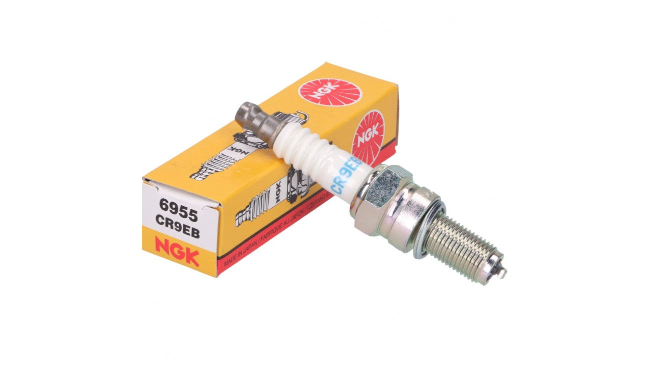 NGK CR9EB spark plug showing the metal terminal and ceramic insulator, designed for automotive engine ignition systems.